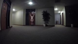 Camille blindfolded and naked in a public office building